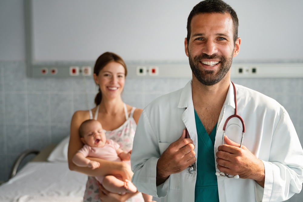 Pediatrician doctor examines baby. Healthcare, people, examination concept