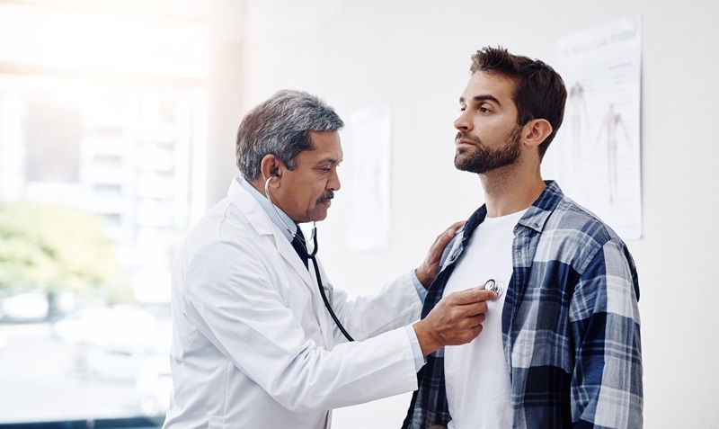 man having gp doctor checkup