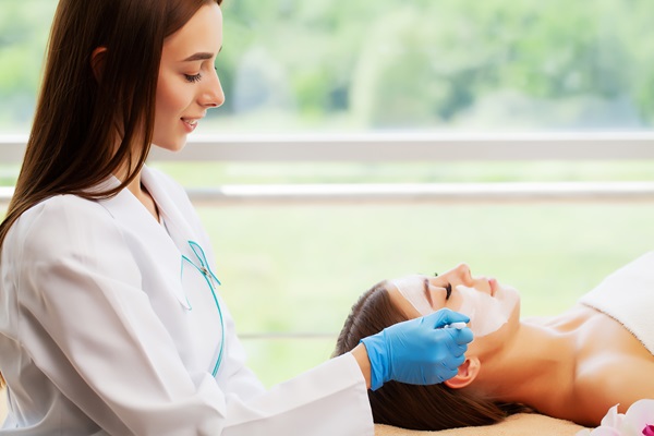 woman cosmetic doctor with lady patient