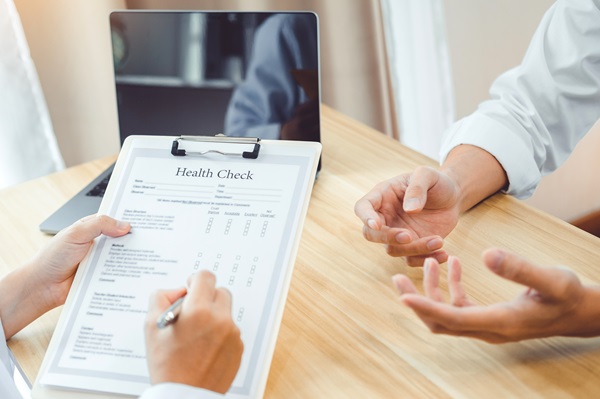 Doctors and patients sit and talk for health check